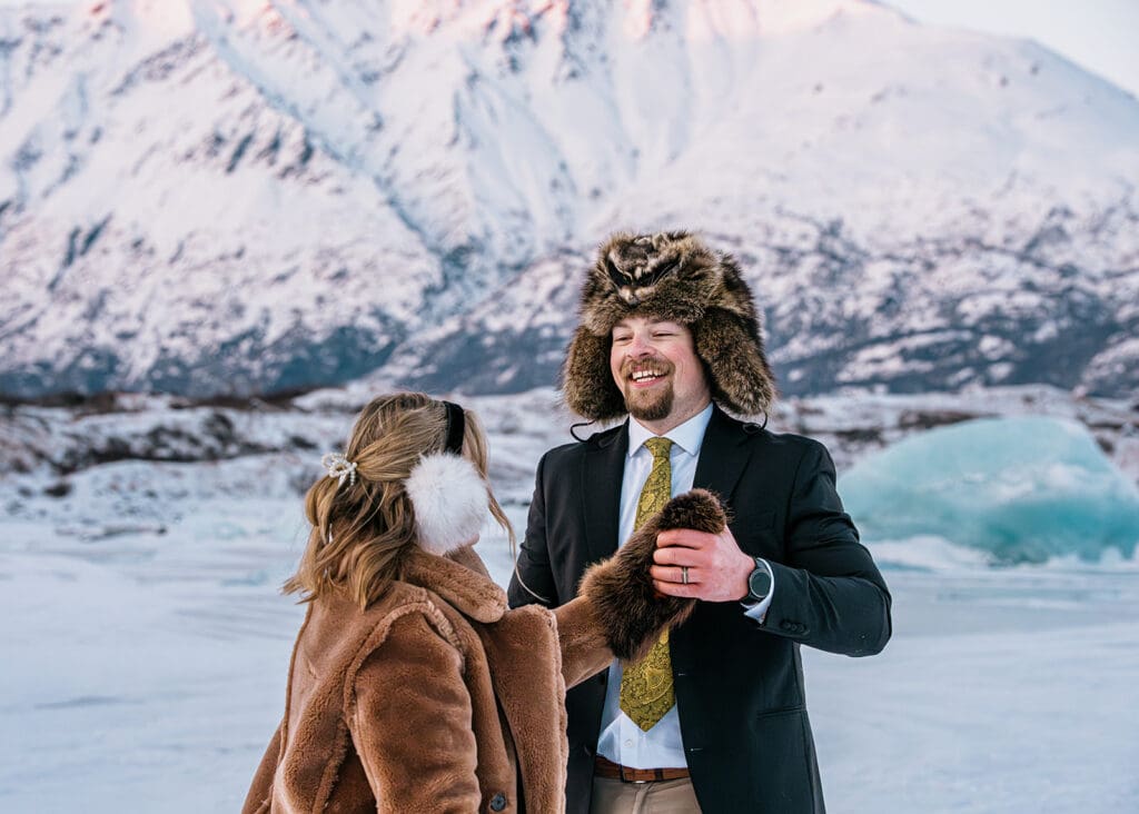 Bride and groom dancing together on Knik Glacier during their Alaska elopement