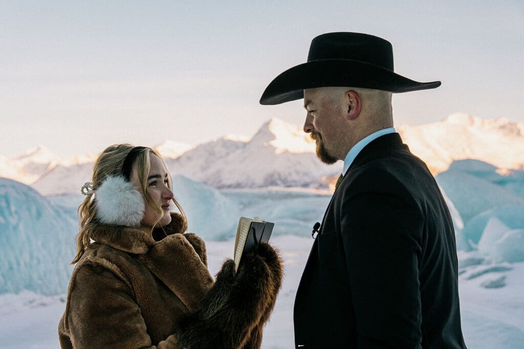 couple saying vows during elopement in alaska
