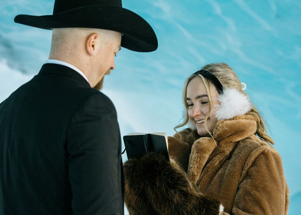 Couple eloping and reading vows