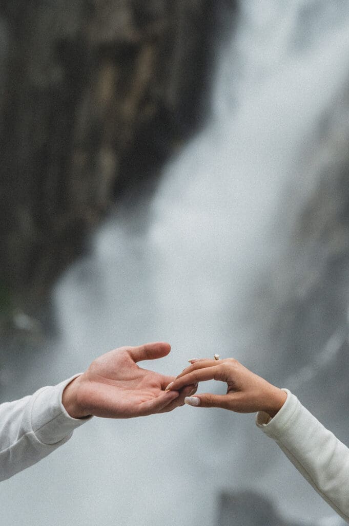Yosemite waterfall holding hands detail shot