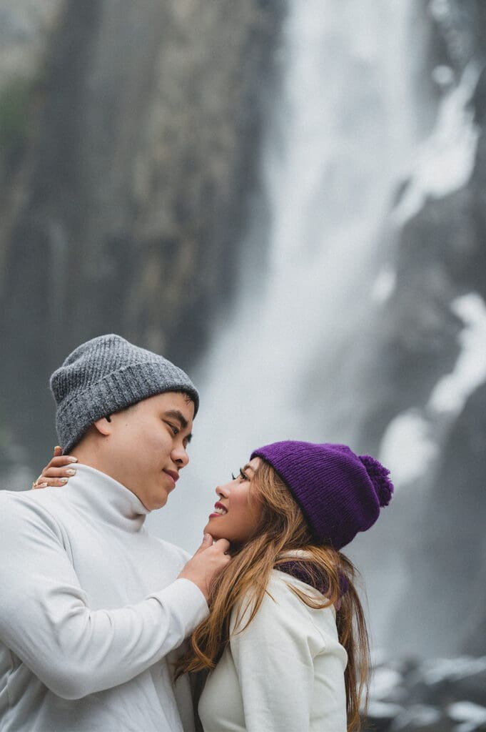 Couple in front of waterfall engagement session