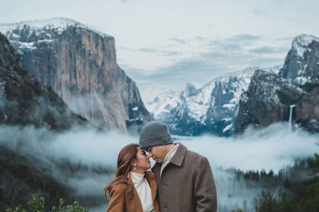 couple at Half Dome Yosemite engagement session snow winter California