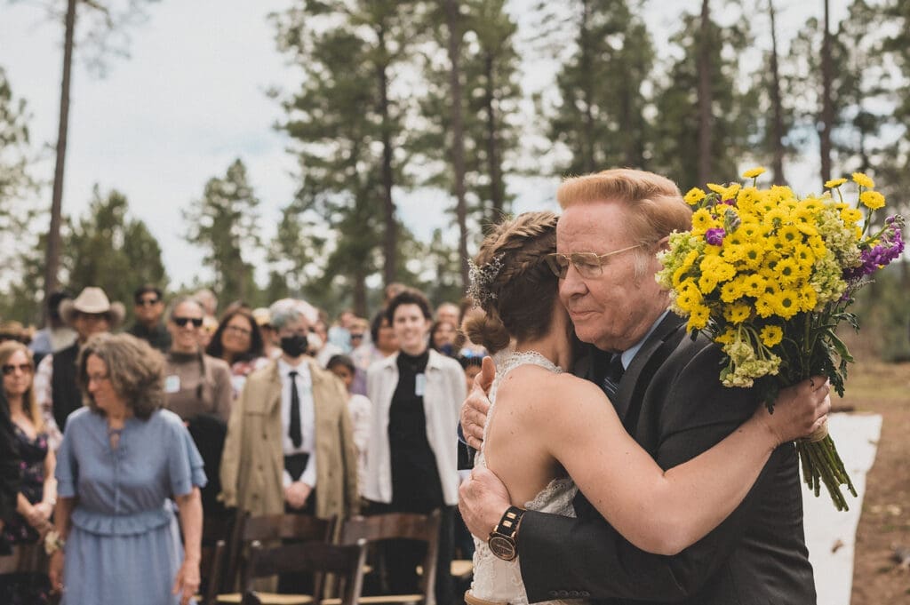 dad hugging bride during elopement