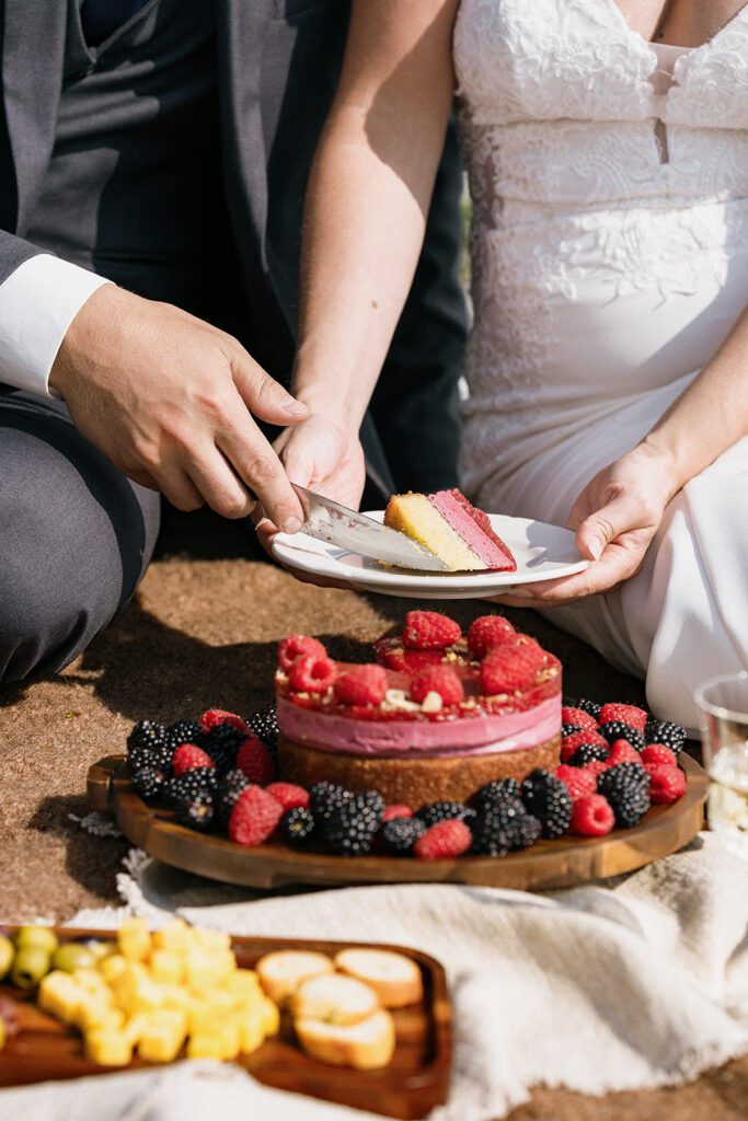 Bride and groom enjoying a picnic during their Alaska elopement
