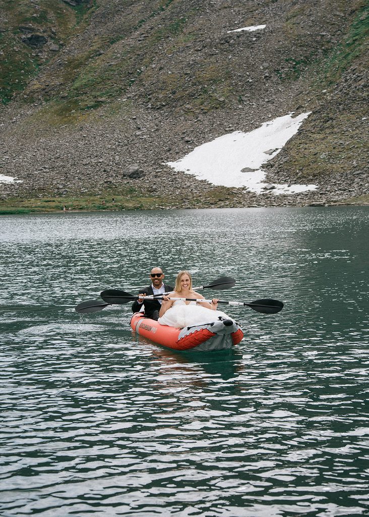 Alt: Bride and groom kayaking on Summit Lake during their Hatcher Pass elopement